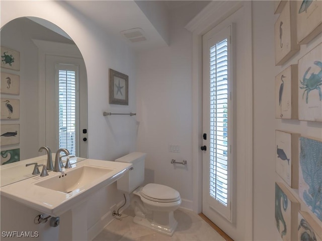 bathroom with sink and toilet