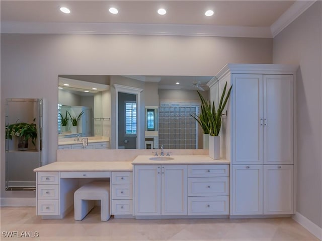 bathroom with vanity and ornamental molding