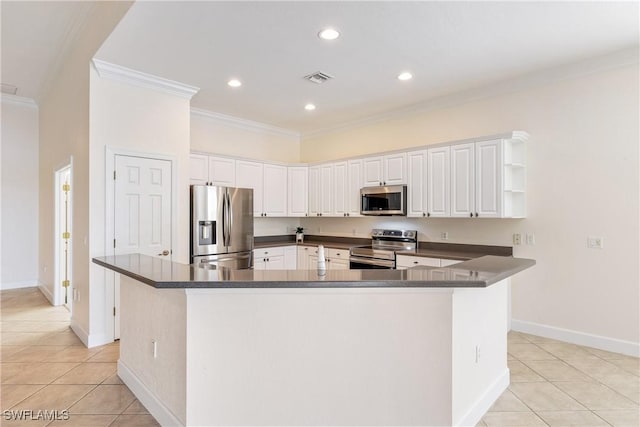 kitchen featuring kitchen peninsula, appliances with stainless steel finishes, ornamental molding, light tile patterned floors, and white cabinetry