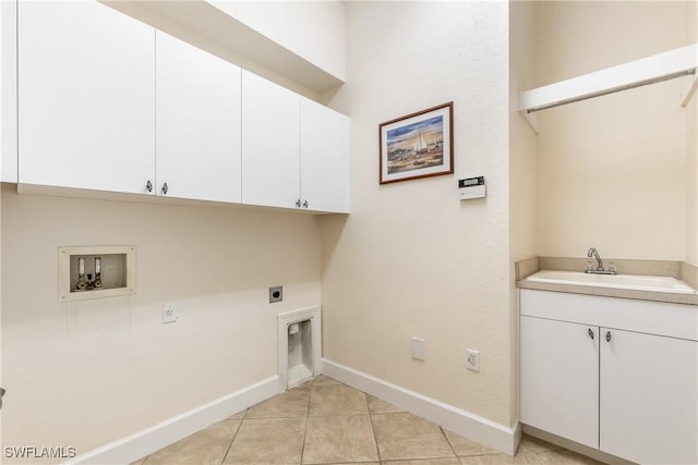 washroom with cabinets, washer hookup, electric dryer hookup, sink, and light tile patterned floors