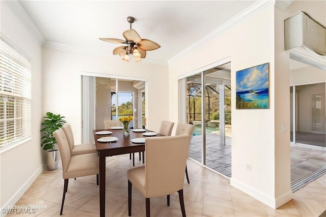 dining space featuring light parquet floors, ceiling fan, and ornamental molding