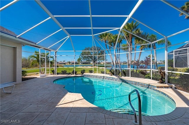 view of swimming pool featuring glass enclosure and a patio