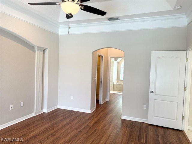 13028 Kingsway Cir SW, Lake Suzy, FL 34269 - unfurnished room featuring ceiling fan, arched walkways, wood finished floors, ornamental molding, and a smoke detector