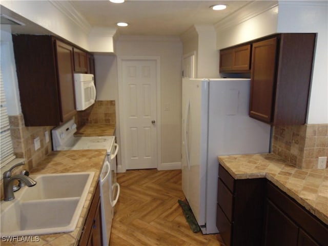 kitchen with sink, tasteful backsplash, crown molding, white appliances, and light parquet flooring