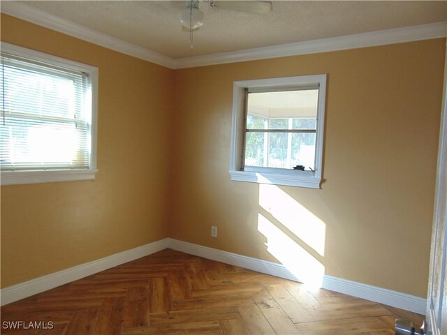 unfurnished room featuring parquet floors and ornamental molding