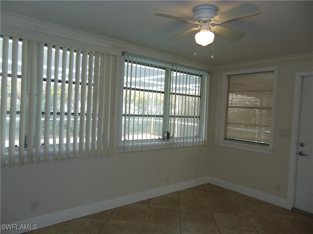 unfurnished sunroom featuring ceiling fan