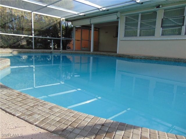 view of pool with a lanai