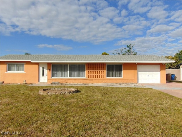 single story home with a garage and a front yard