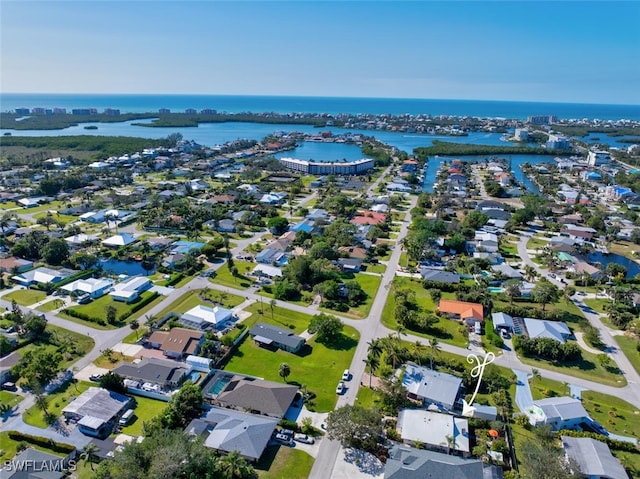 bird's eye view featuring a residential view and a water view