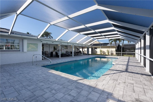 view of pool featuring a patio area and a lanai