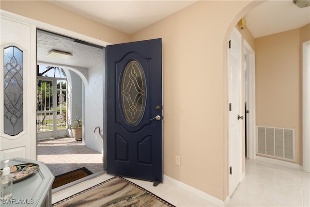 view of tiled foyer entrance