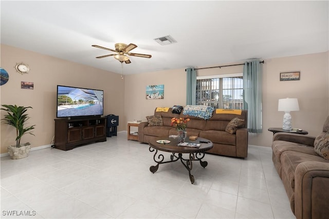 living room featuring ceiling fan and light tile patterned flooring