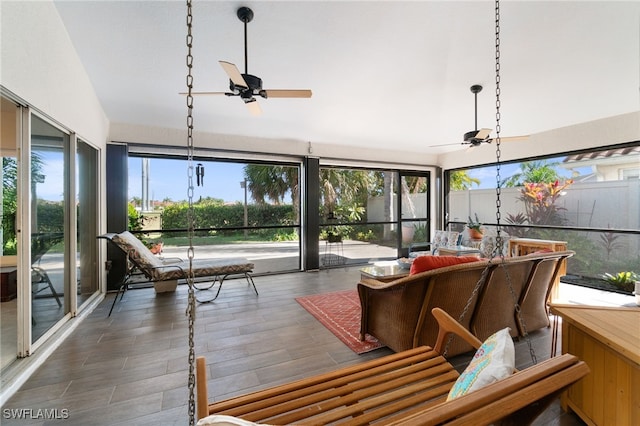 sunroom featuring ceiling fan