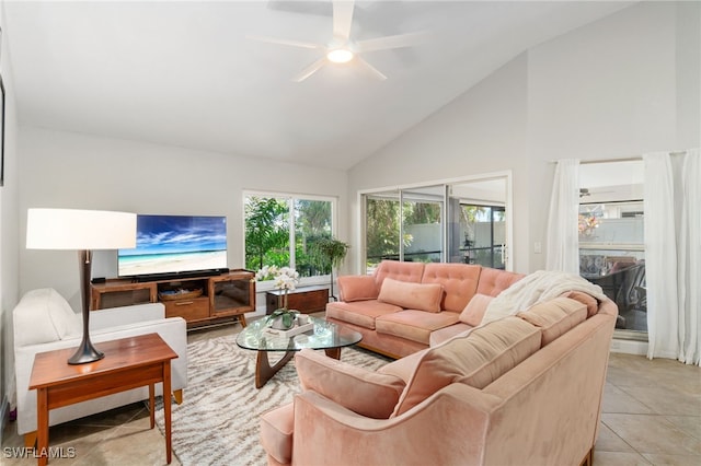 living room featuring ceiling fan, high vaulted ceiling, and light tile patterned flooring