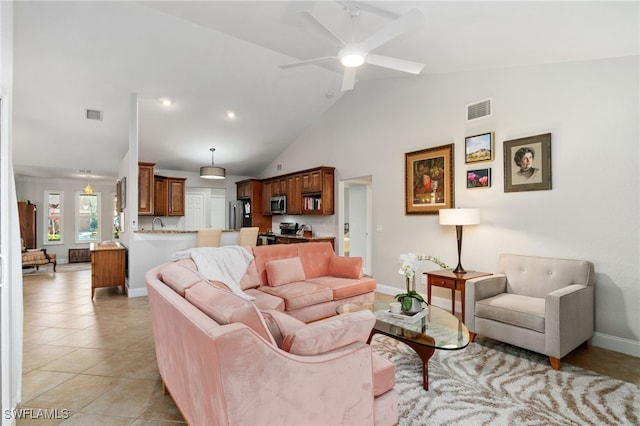 living room with ceiling fan, high vaulted ceiling, and light tile patterned flooring