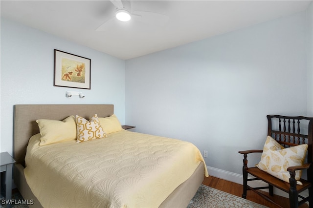 bedroom featuring wood-type flooring and ceiling fan