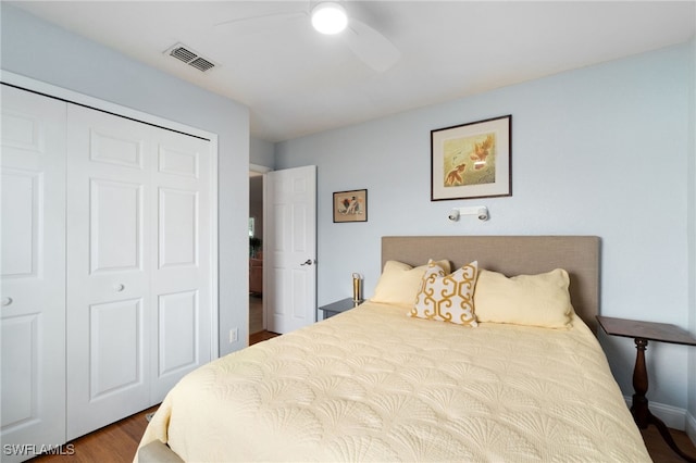 bedroom with a closet, ceiling fan, and hardwood / wood-style flooring