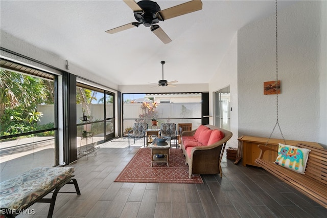 sunroom featuring vaulted ceiling and ceiling fan