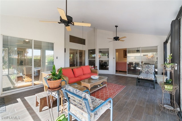 sunroom / solarium featuring lofted ceiling and ceiling fan