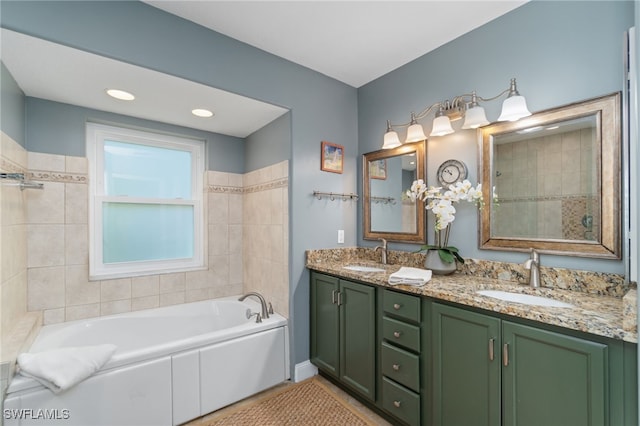 bathroom with a bath and vanity