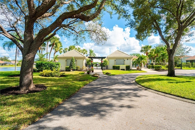 view of front of house featuring a front yard and a water view