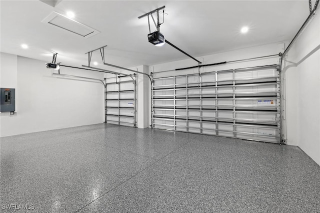 garage featuring electric panel and a garage door opener