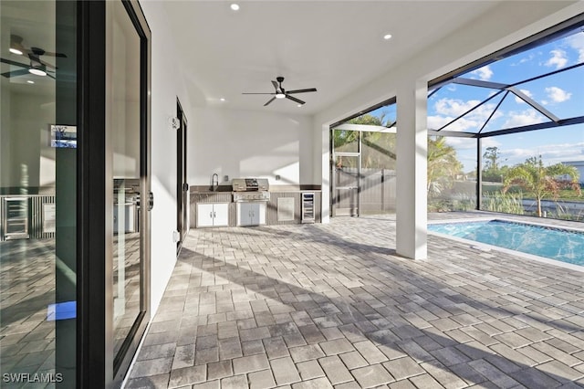 view of pool featuring a patio area, ceiling fan, a lanai, grilling area, and area for grilling