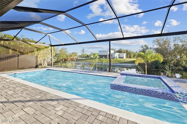 view of swimming pool featuring glass enclosure, an in ground hot tub, and a water view