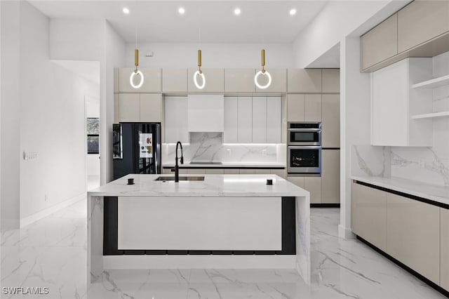 kitchen with light stone countertops, sink, black fridge, double oven, and pendant lighting