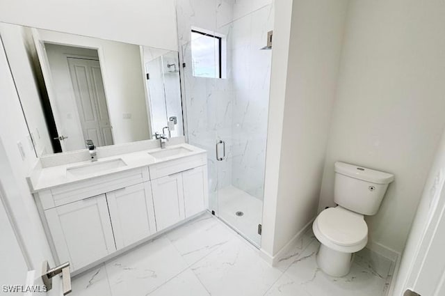 bathroom featuring a shower with door, vanity, and toilet