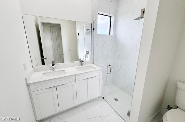 bathroom with toilet, vanity, and walk in shower