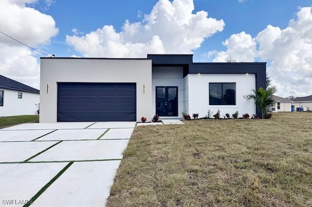 view of front facade featuring a garage and a front yard