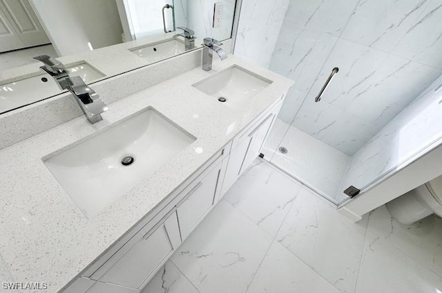 bathroom featuring vanity and a shower