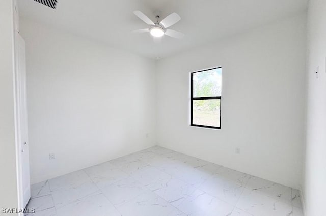 spare room with ceiling fan