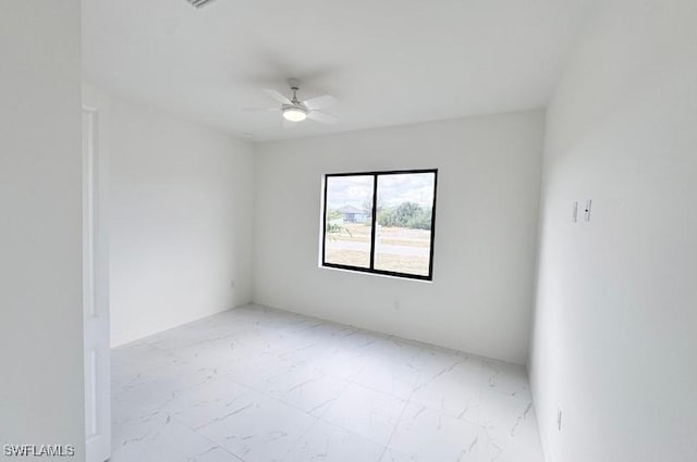 spare room featuring ceiling fan