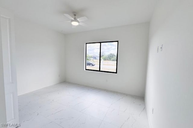 unfurnished room with ceiling fan