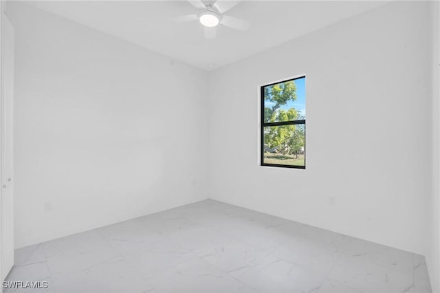 spare room featuring ceiling fan