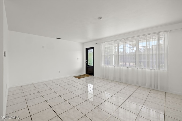 empty room featuring light tile patterned floors