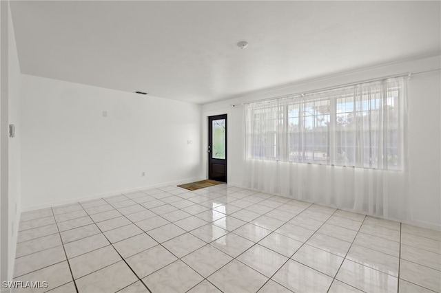 21 E Mariana Ave, North Fort Myers, FL 33917 - spare room with light tile patterned floors