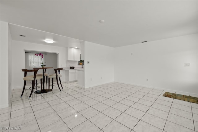 21 E Mariana Ave, North Fort Myers, FL 33917 - dining space with light tile patterned floors and baseboards