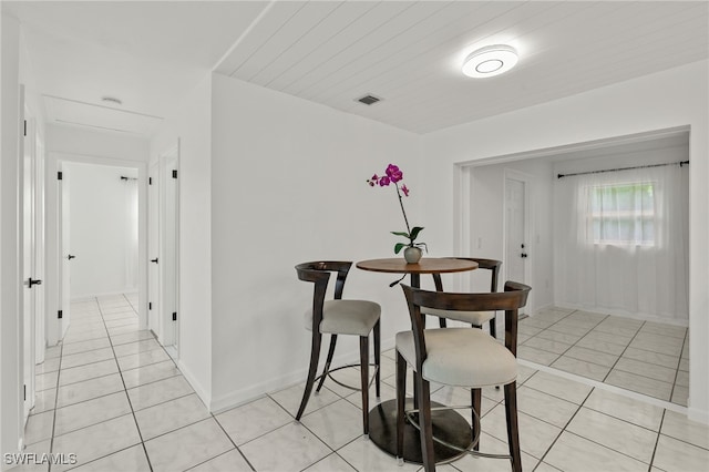 dining area with light tile patterned flooring