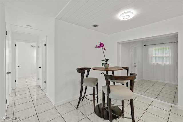 21 E Mariana Ave, North Fort Myers, FL 33917 - dining space with light tile patterned floors and attic access