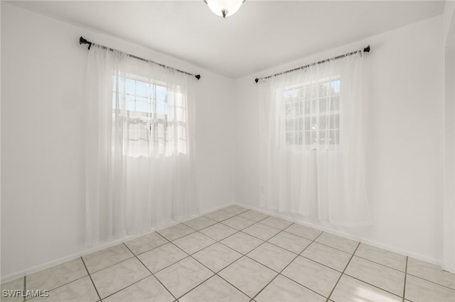 empty room featuring light tile patterned floors