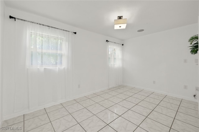 tiled empty room with plenty of natural light