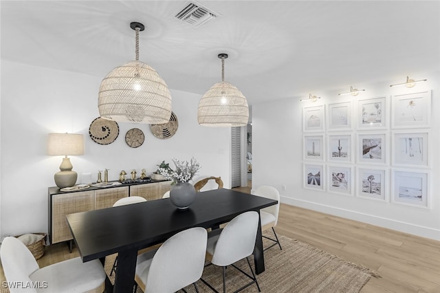 dining area featuring light wood-type flooring