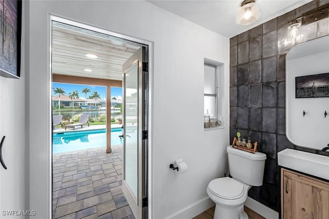 bathroom featuring vanity and toilet