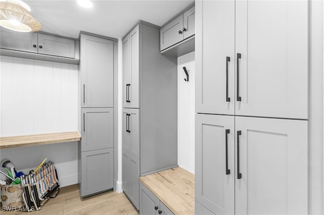 mudroom with light hardwood / wood-style floors