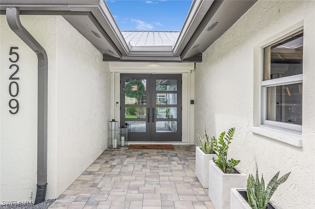 entrance to property featuring french doors