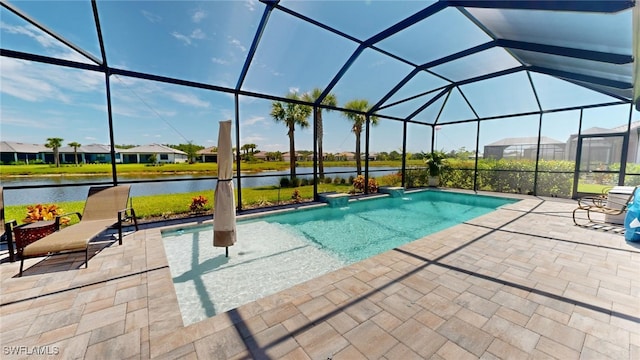 view of swimming pool with a lanai, a patio area, and a water view