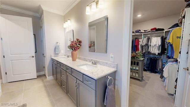 bathroom with tile patterned floors, vanity, and ornamental molding